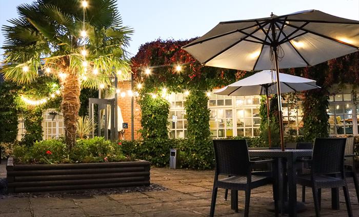 Oscar’s outside terrace at Rossett Hall Hotel in the evening light.